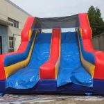 Colorful bounce house with an attached slide