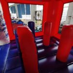 Superhero themed inflatable bounce house