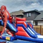 Spiderman themed inflatable bounce house with slide