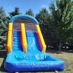 Colorful bounce house with an attached slide