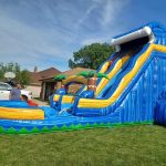 Colorful bounce house with an attached slide