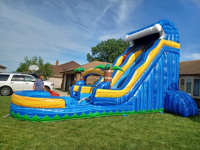 Colorful bounce house with an attached slide